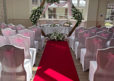 Wedding Ceremony Layout with pink chair sashes
