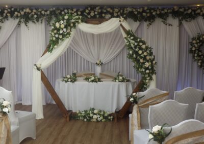 Wedding Ceremony set in cream and white with archway
